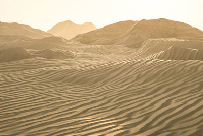 Scenic view of desert against clear sky