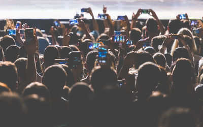 Crowd photographing with smart phones at music concert