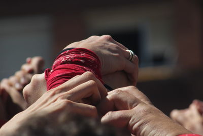 Close-up of couple holding hands