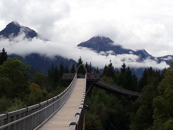 Panoramic view of bridge over mountains against sky