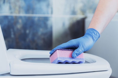 Low section of man washing hands