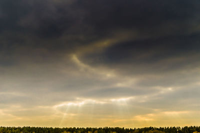 Scenic view of landscape against cloudy sky