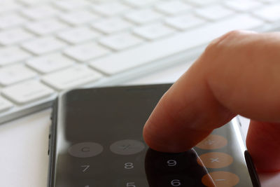 Close-up of hand using mobile phone