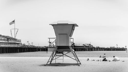 Lifeguard hut at beach against sky