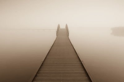 Jetty on river at dawn