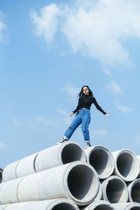 Low angle view of woman against sky