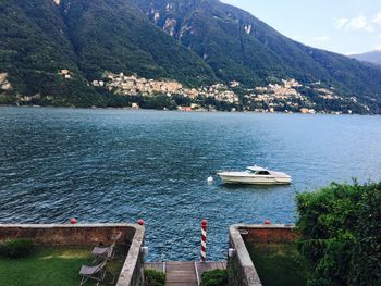 High angle view of boats sailing in lake against sky