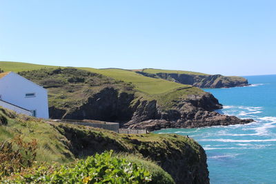 Scenic view of sea against clear blue sky