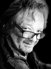 Close-up portrait of young man wearing eyeglasses