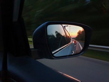 Reflection of car on side-view mirror