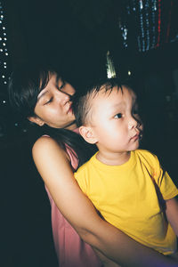 Happy boy smiling at night