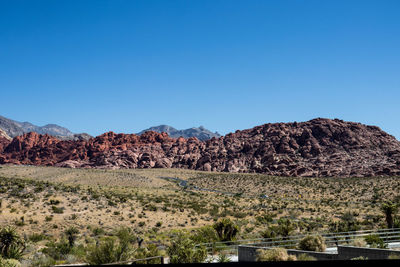 Scenic view of rocky mountains against clear blue sky