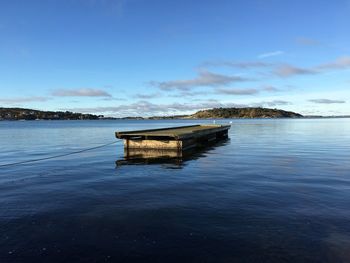 Built structure in water against sky