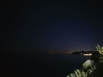 Scenic view of sea against sky at night