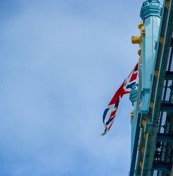 Low angle view of flag against clear blue sky