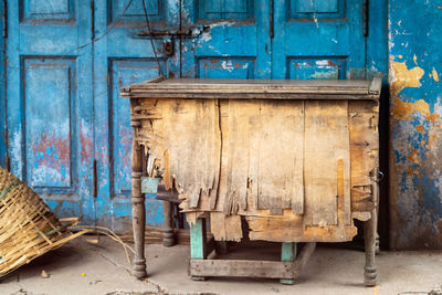 Old abandoned house against blue door