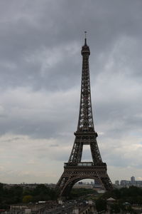 Low angle view of tower against cloudy sky