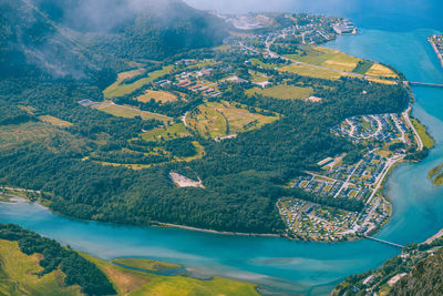 Aerial view of cityscape by sea