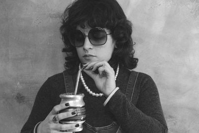 Portrait of woman drinking argentinian traditional drink