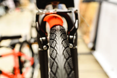 Close-up of bicycle parked on metal grate