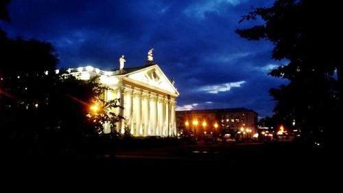 View of illuminated street lights at night