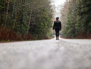 Full length of man standing in forest