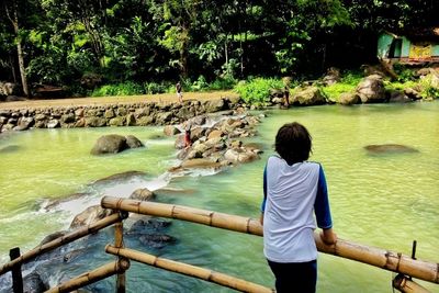 Man looking at river