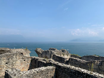 Scenic view of sea against blue sky