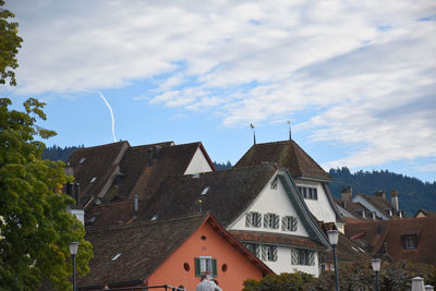 House-tops of traditional swiss houses with blue sky
