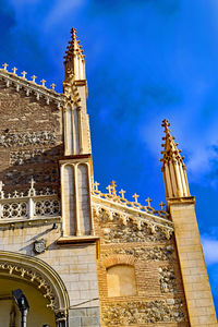 Low angle view of church against blue sky