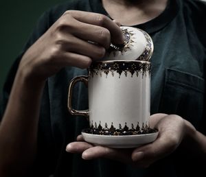 Midsection of woman holding ice cream