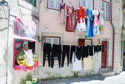 Clothes drying on clothesline outside building