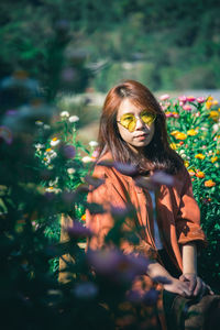 Portrait of woman with plants