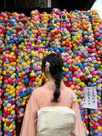 Rear view of woman standing in traditional clothing