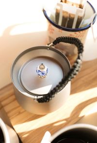 High angle view of coffee cup on table