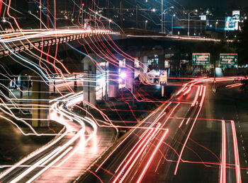 Digital composite image of light trails on city street