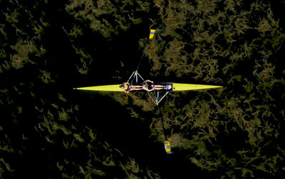 Aerial view of people rowing boat on sea