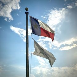 Low angle view of flag against sky