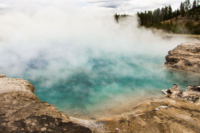 Smoke emitting from volcanic mountain