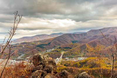 Scenic view of landscape and mountains against sky