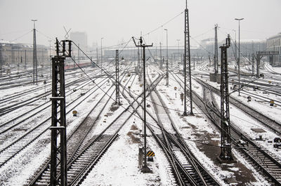 High angle view of snow covered railroad tracks against sky