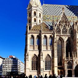 Low angle view of building against blue sky