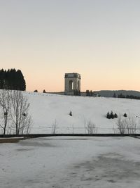 Scenic view of historic building against clear sky during winter