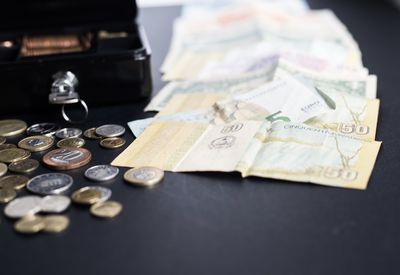 High angle view of coins on table