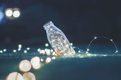 Close-up of illuminated water at night