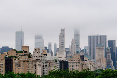 Modern buildings in city against sky