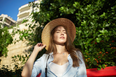 Portrait of a beautiful young woman wearing hat