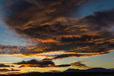 Low angle view of dramatic sky during sunset