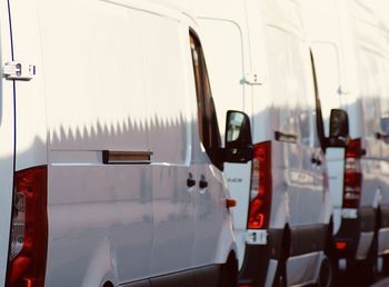 Close-up of white cars in a row 