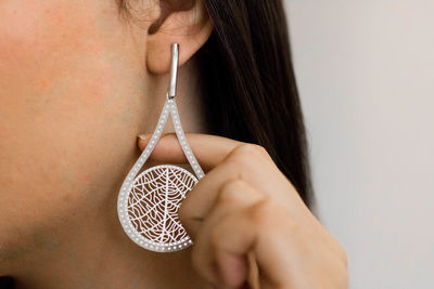 Cropped image of woman touching earring